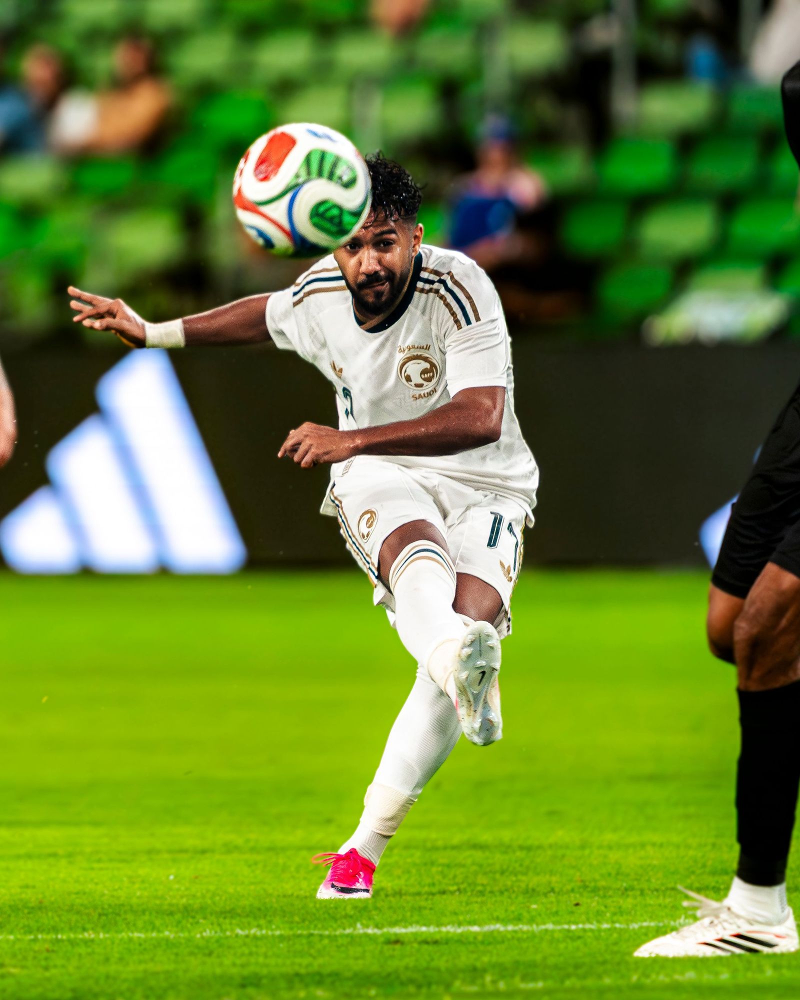 Soccer player striking a volley at Q2 Stadium