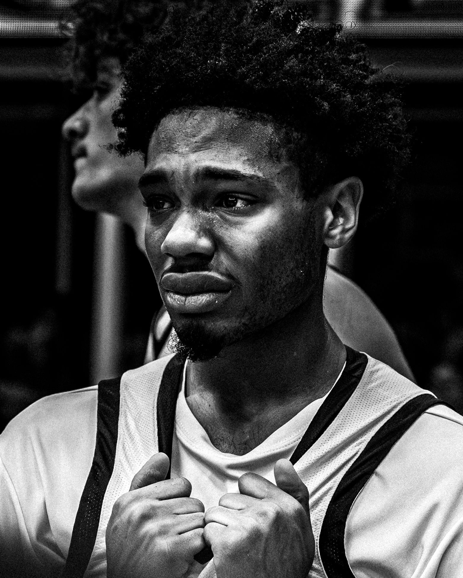 Black and white portrait of a basketball player in a white jersey