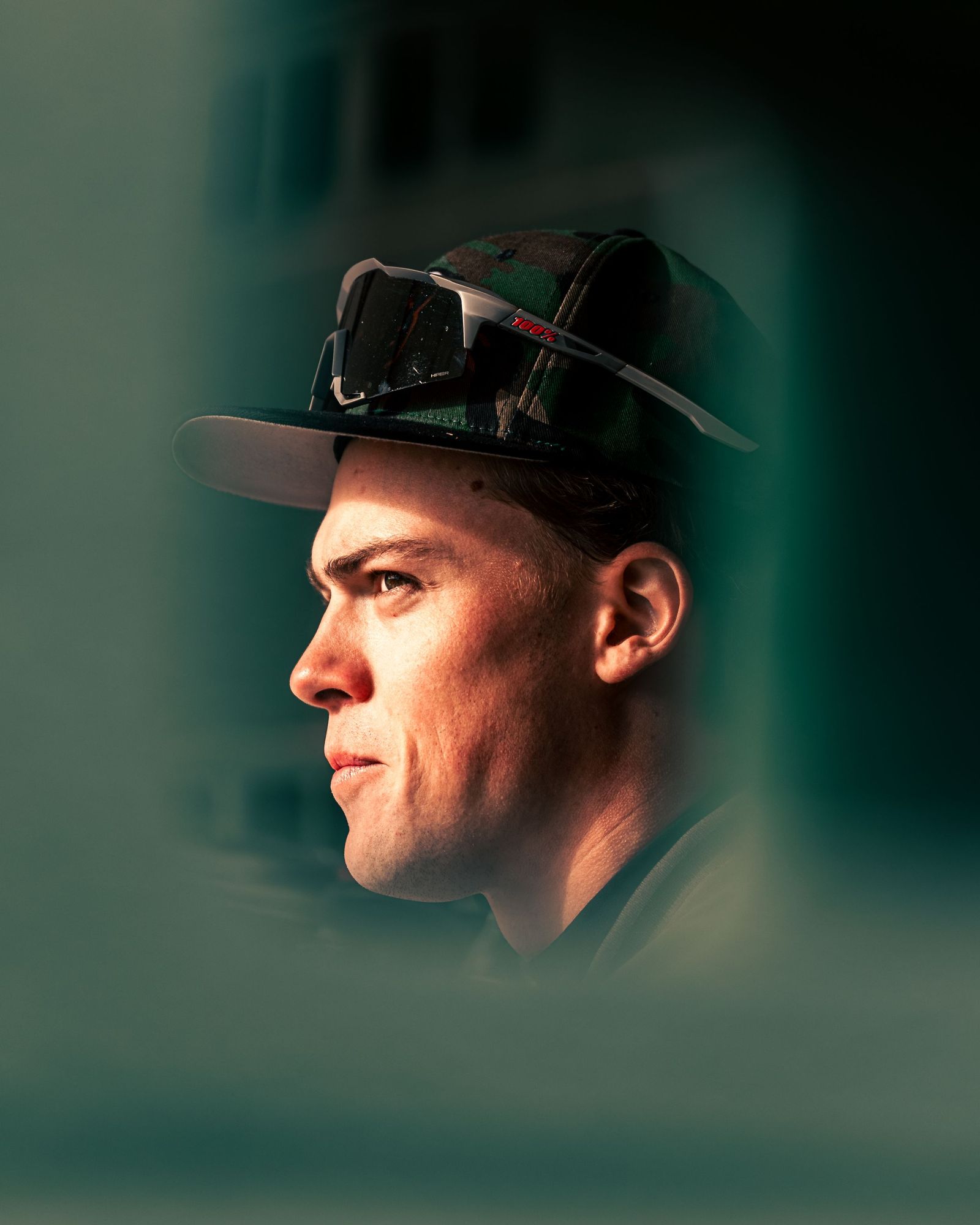 Profile of a baseball player in a cap and sunglasses