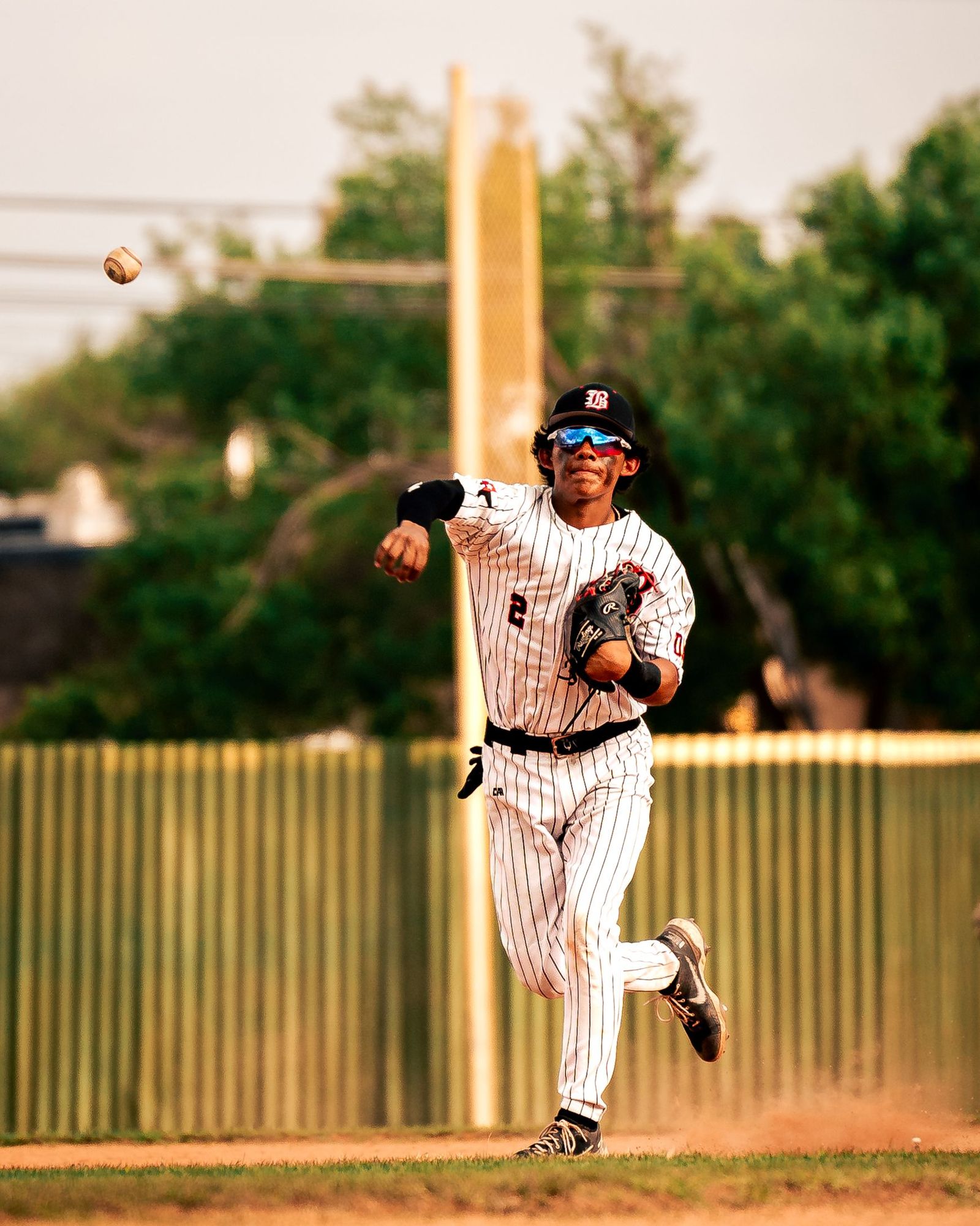 Infielder fielding a grounder on the run