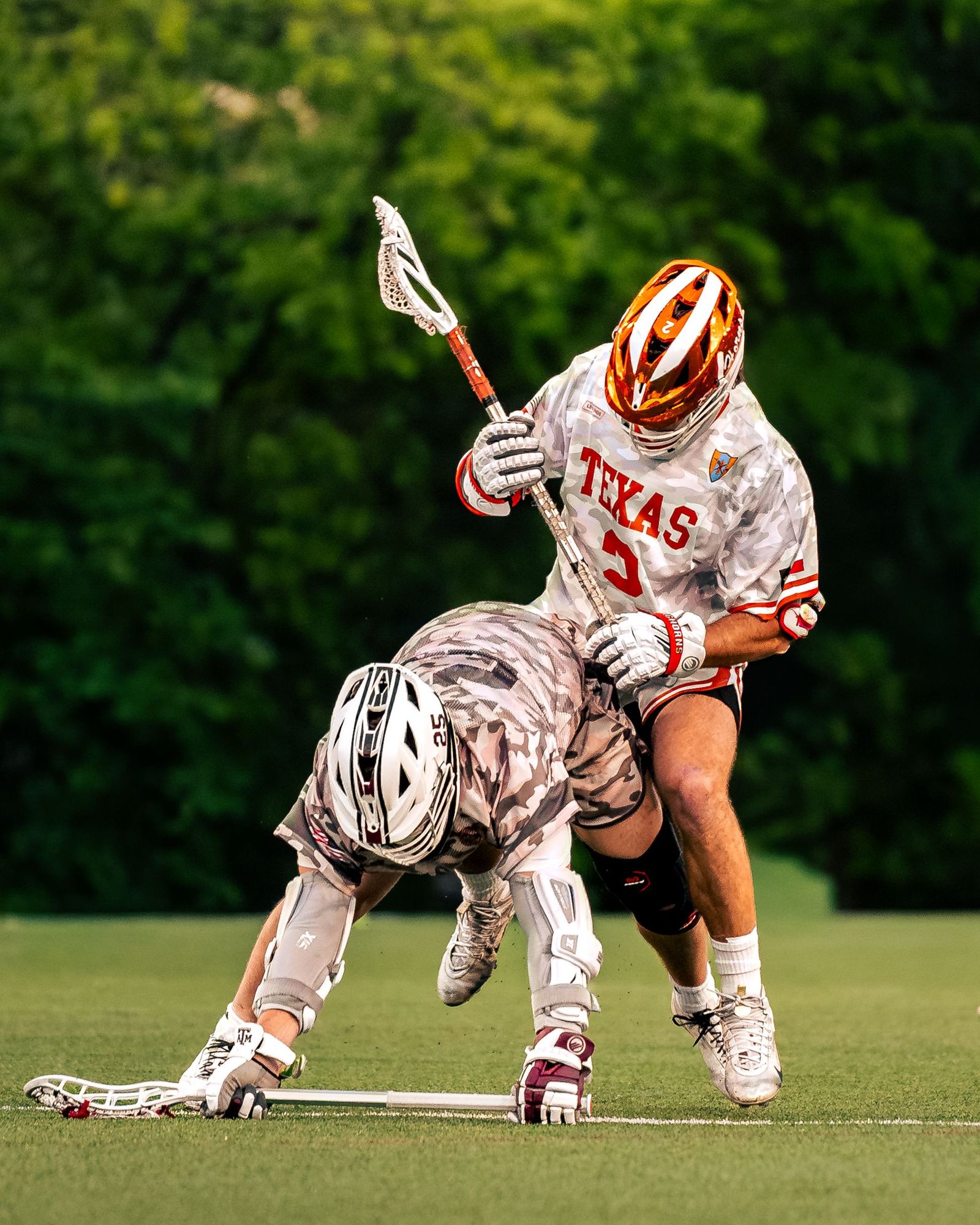 Texas lacrosse player dodging a defender