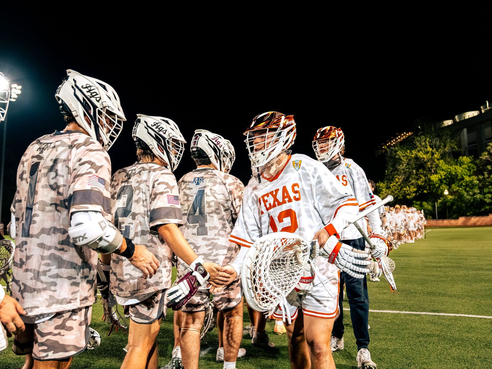 Lacrosse team lined up with sticks before the game