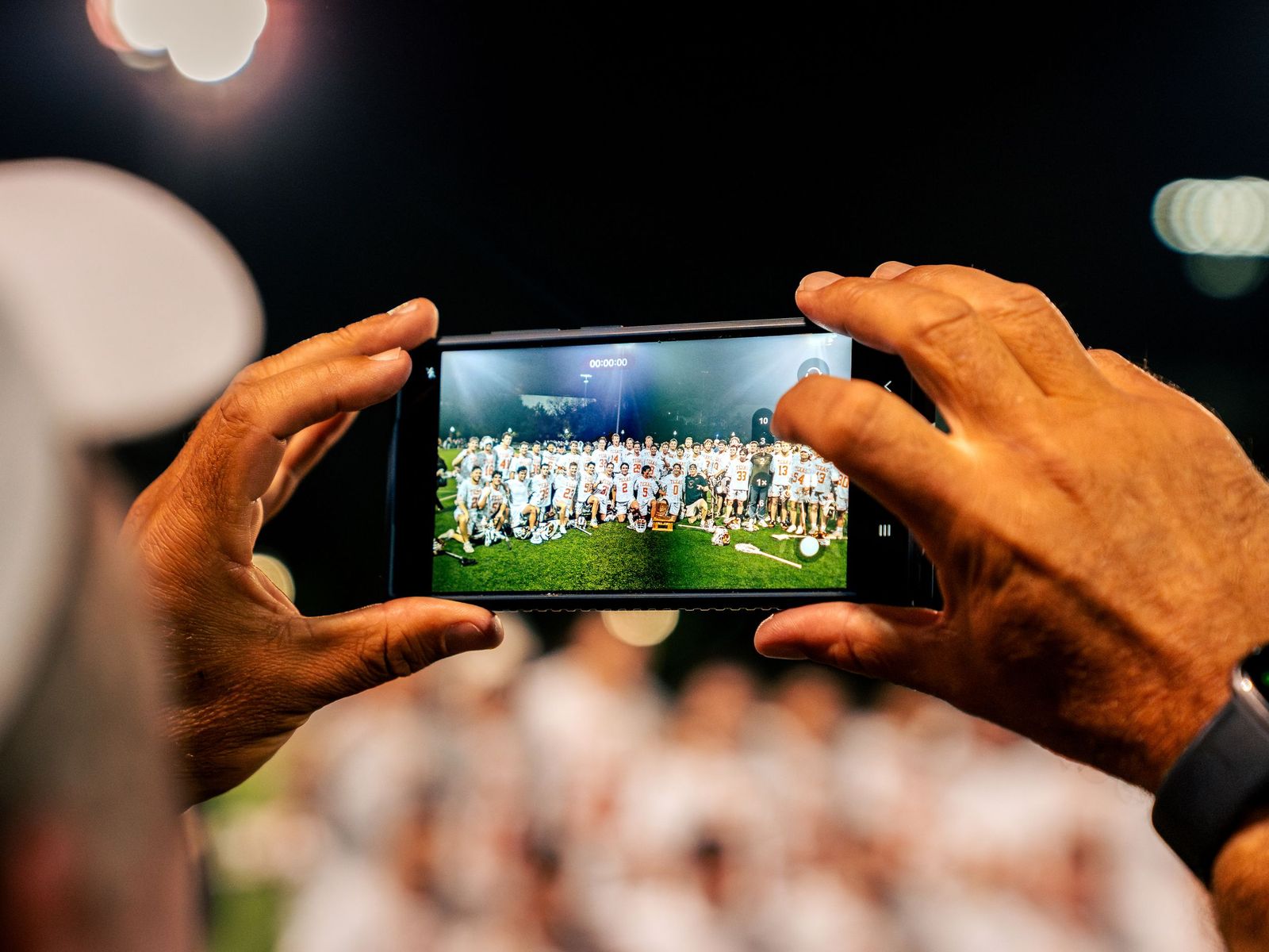 A phone photographing a team photo