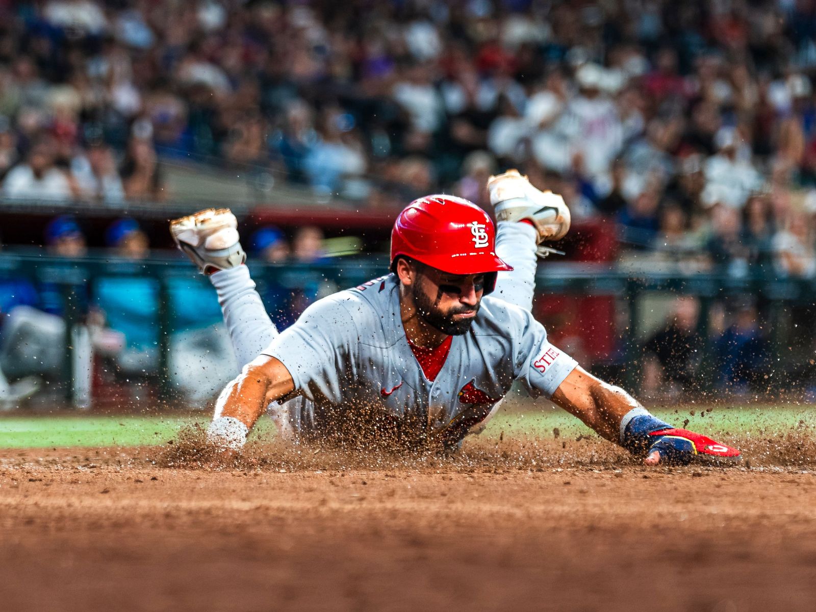Cardinals runner sliding headfirst into a base