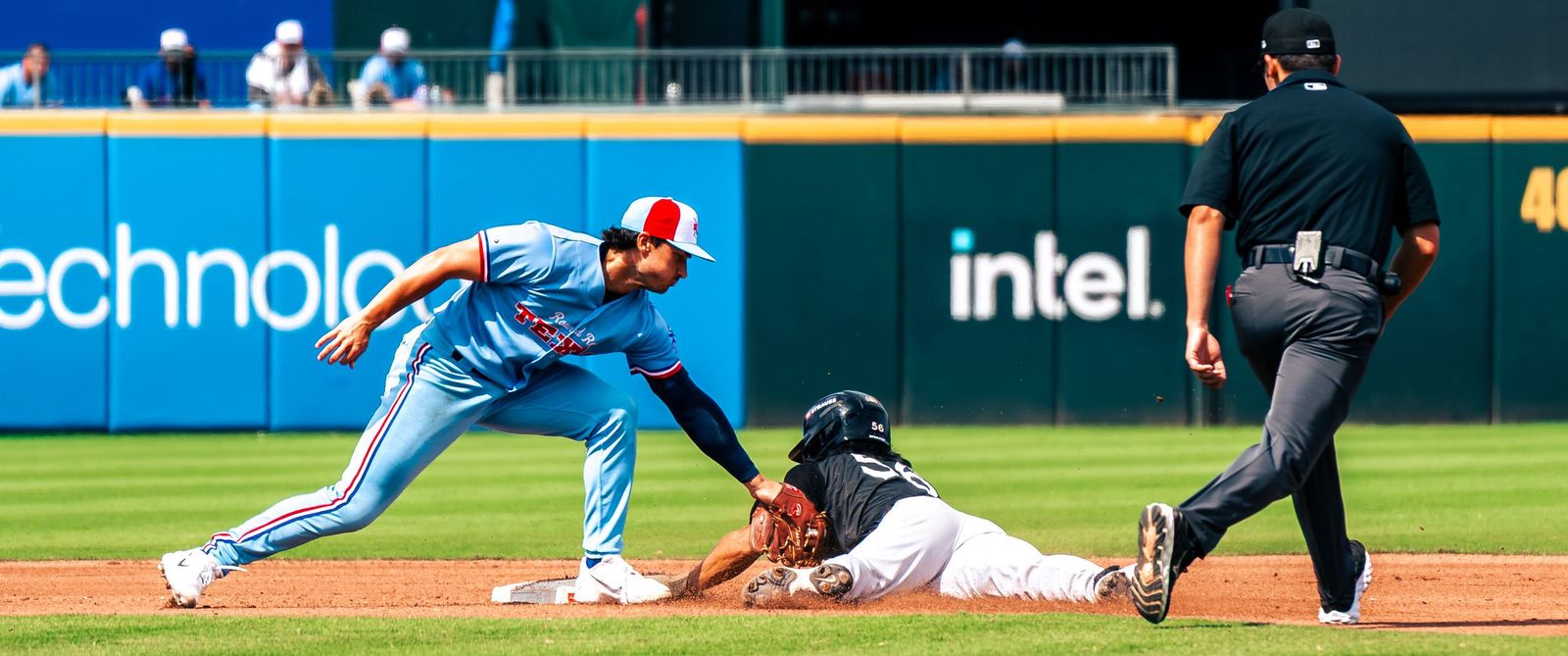 Fielder applying a tag as the runner slides