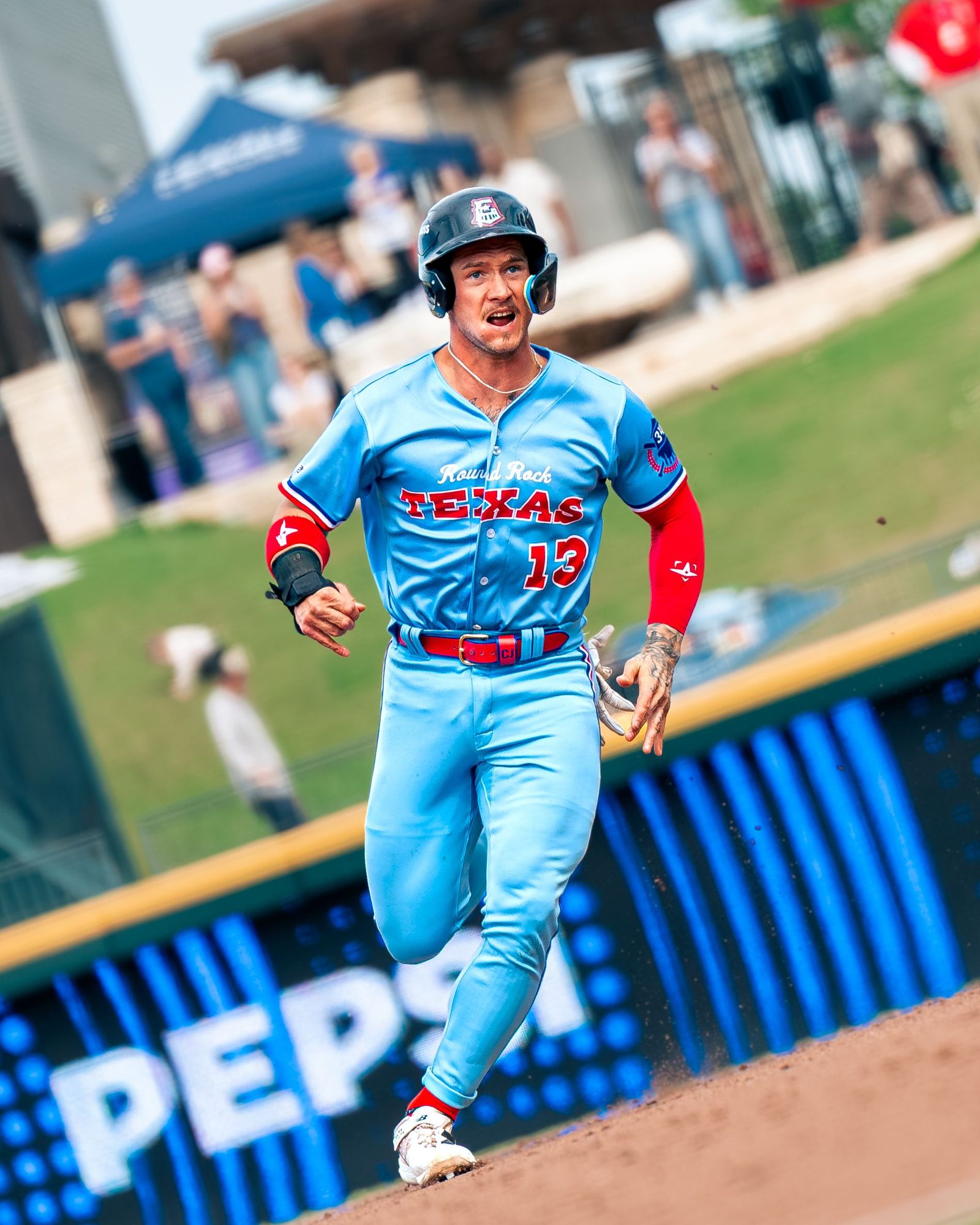 Texas number 13 running the bases
