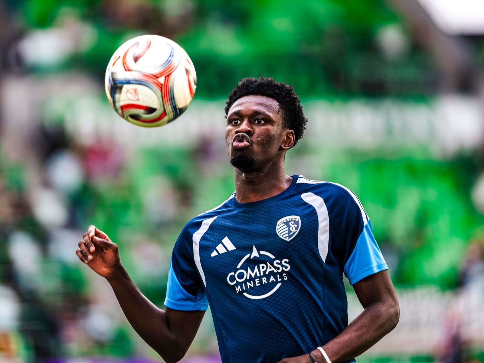 Sporting KC player heading the ball