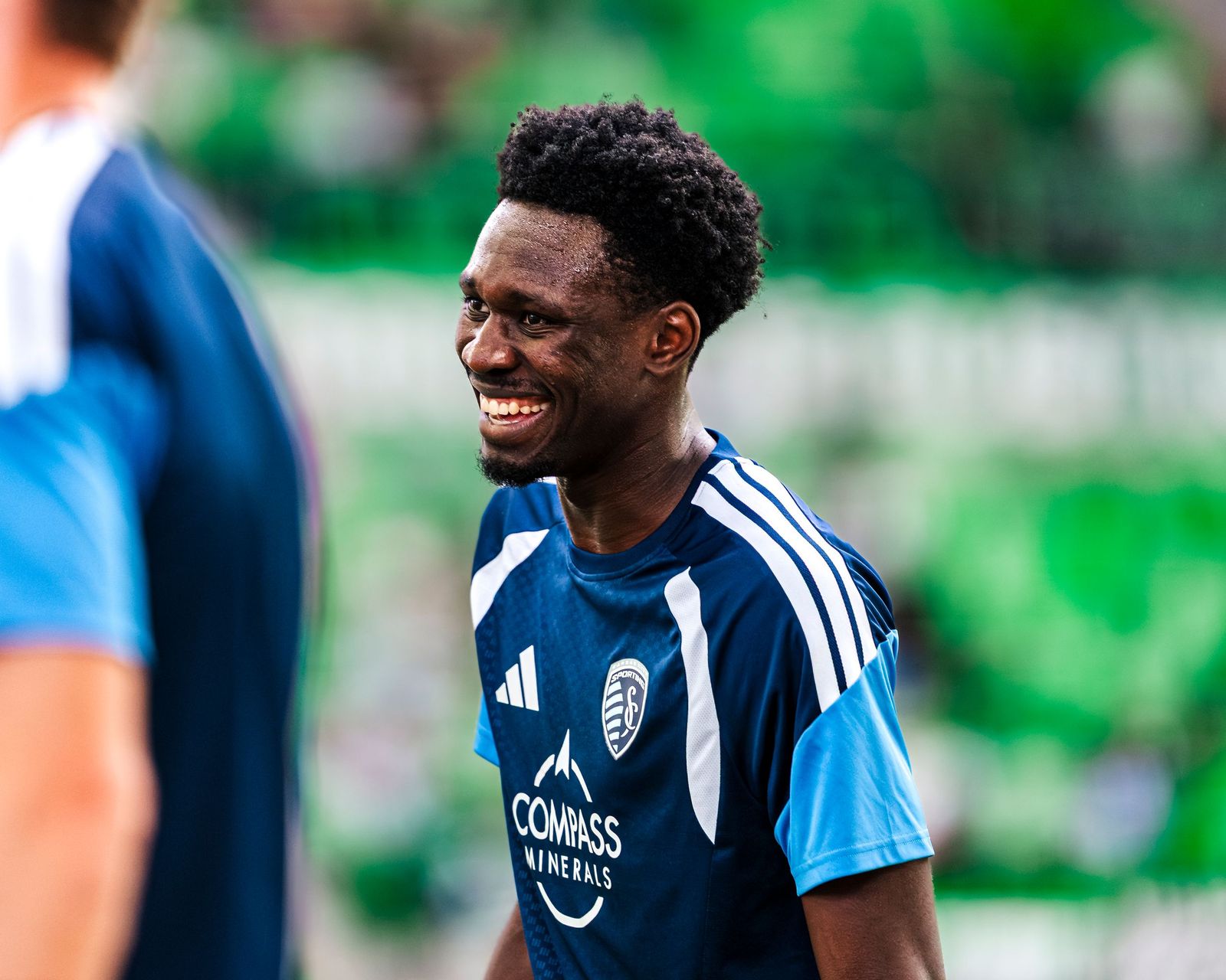 Sporting KC player smiling during warmups