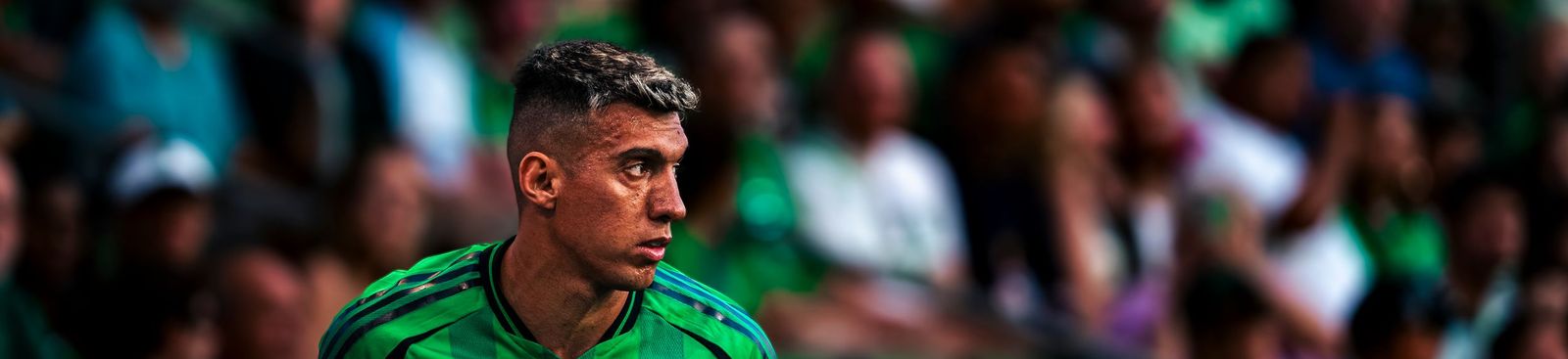Close-up of an Austin FC player watching the play