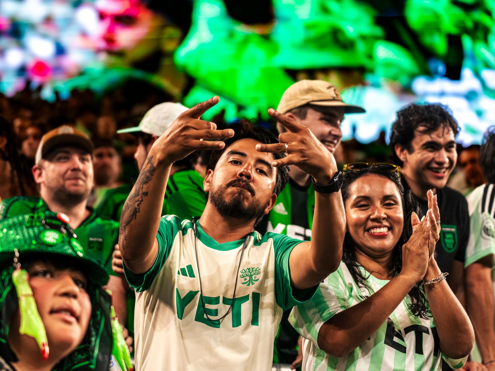 Austin FC fans celebrating in the stands