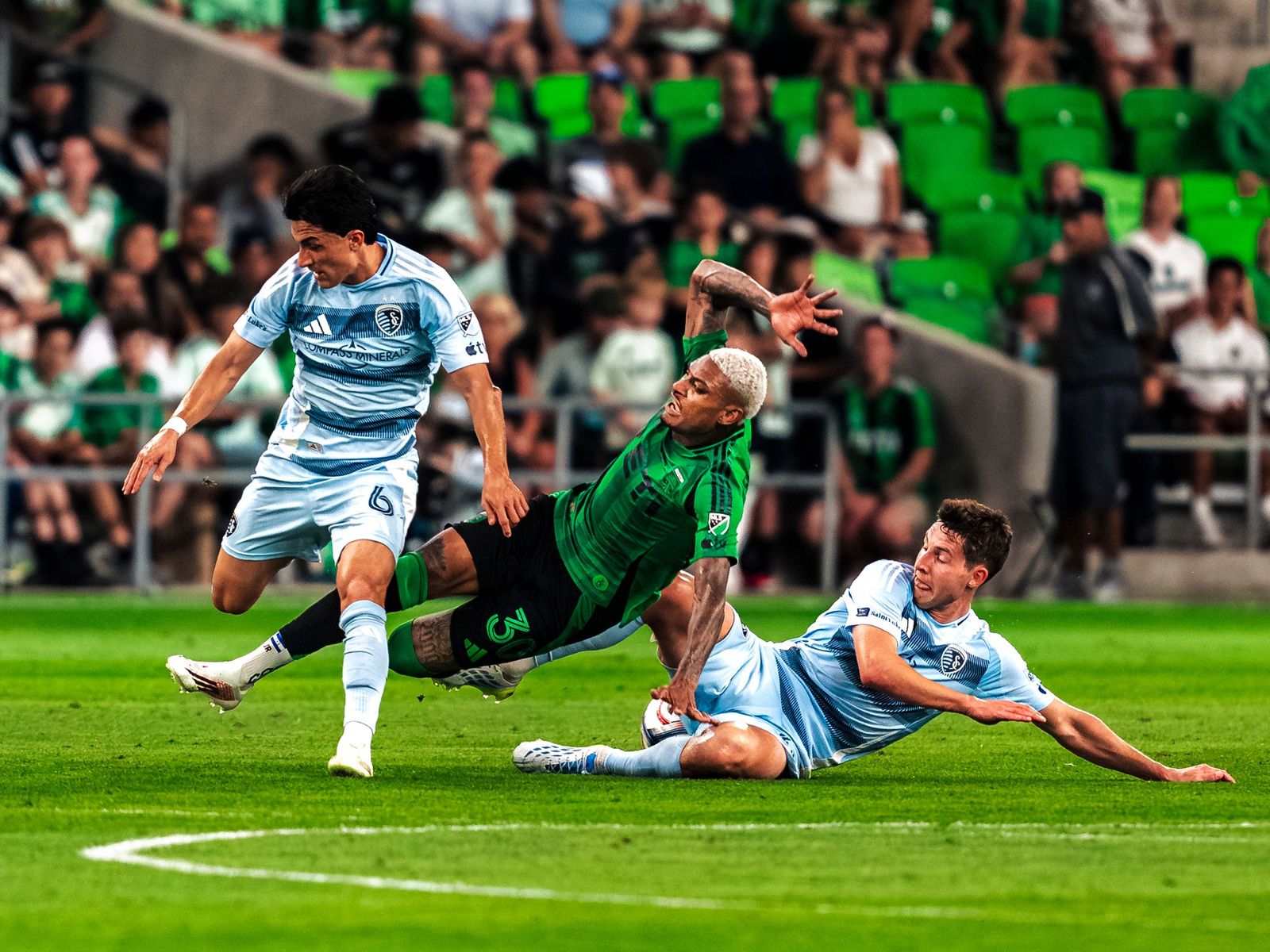 Sliding tackle in front of the bench