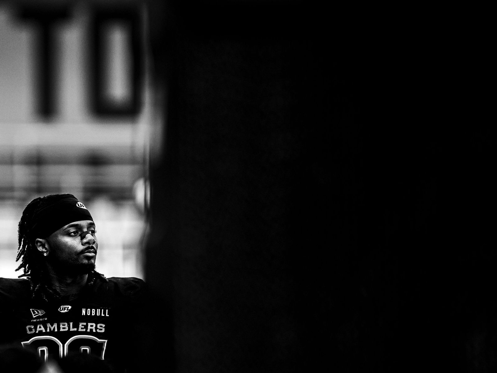 Houston Gamblers player in the tunnel, black and white