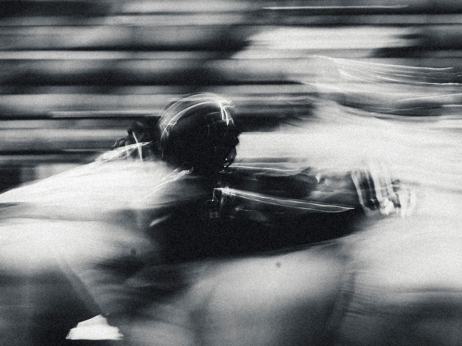 Football player in a motion blur, black and white