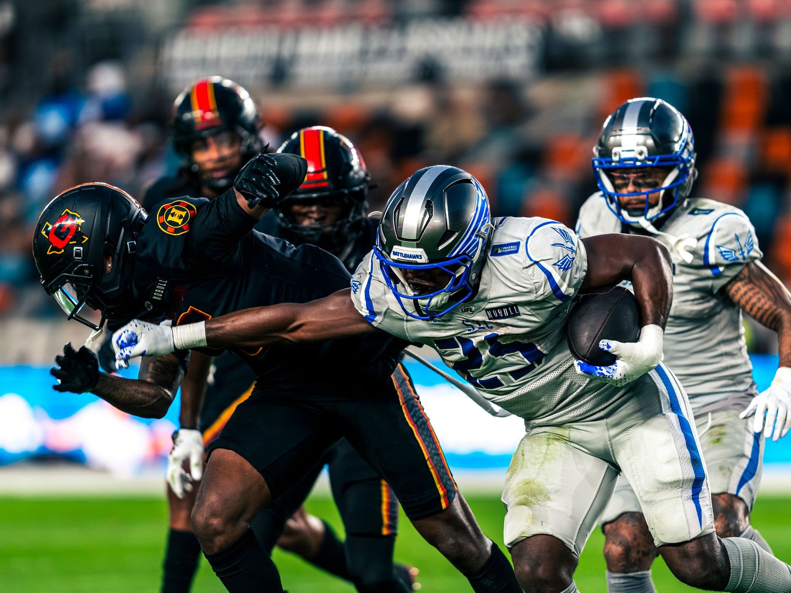 Houston Gamblers defenders wrapping up a ball carrier