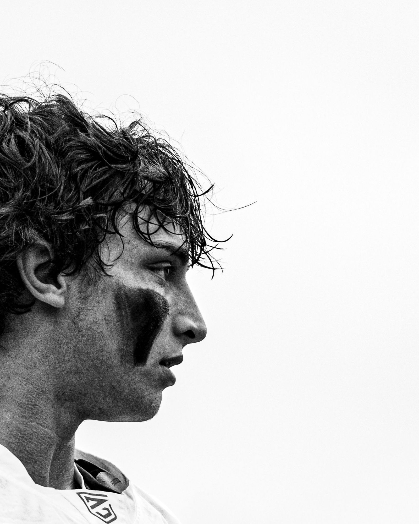 Profile of a lacrosse player with eye black
