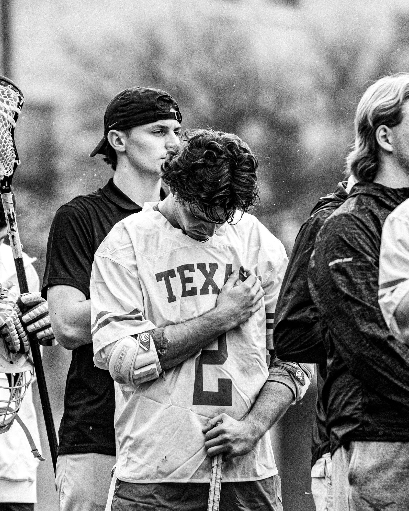Texas lacrosse players before a game, black and white