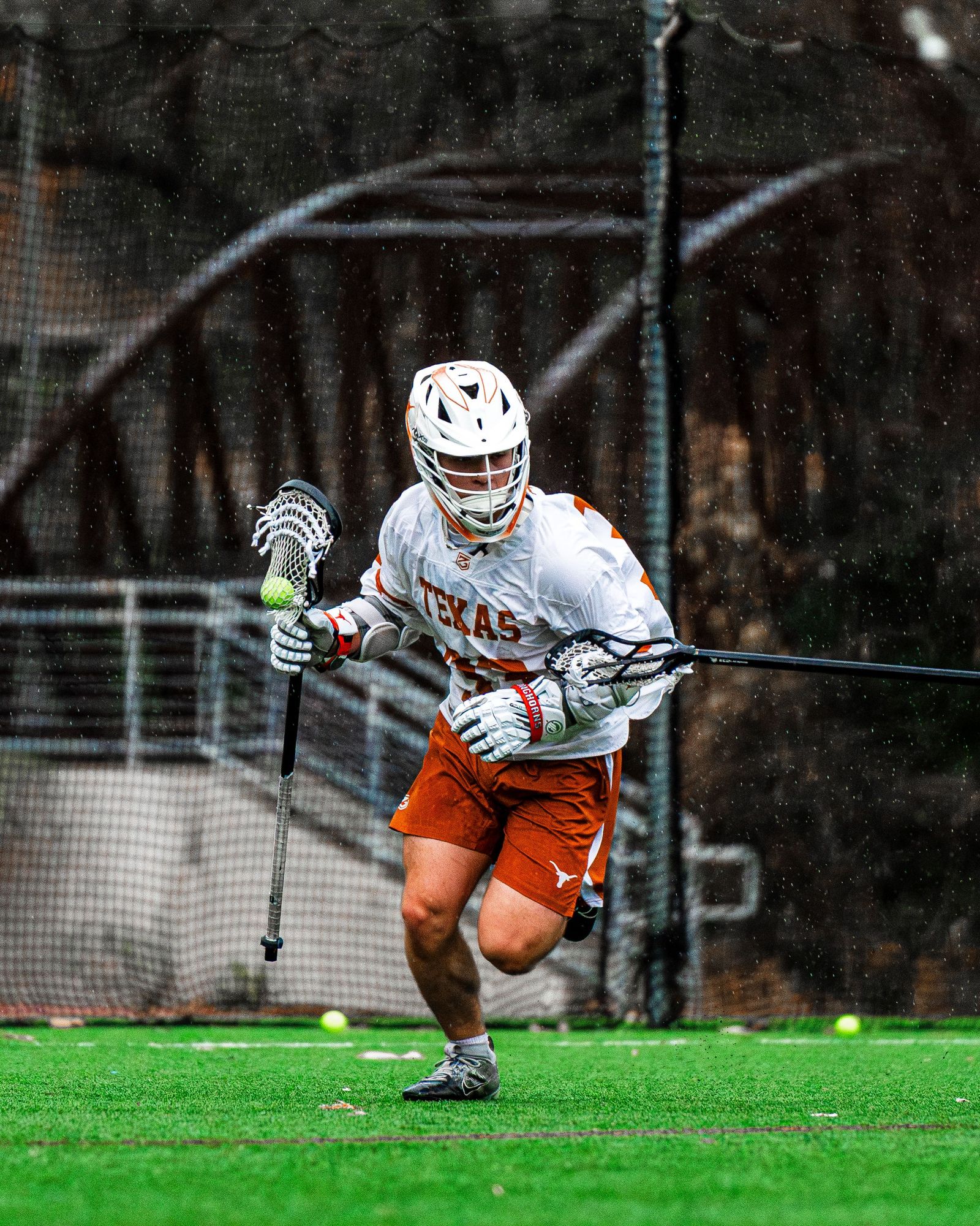 Texas lacrosse player cradling the ball