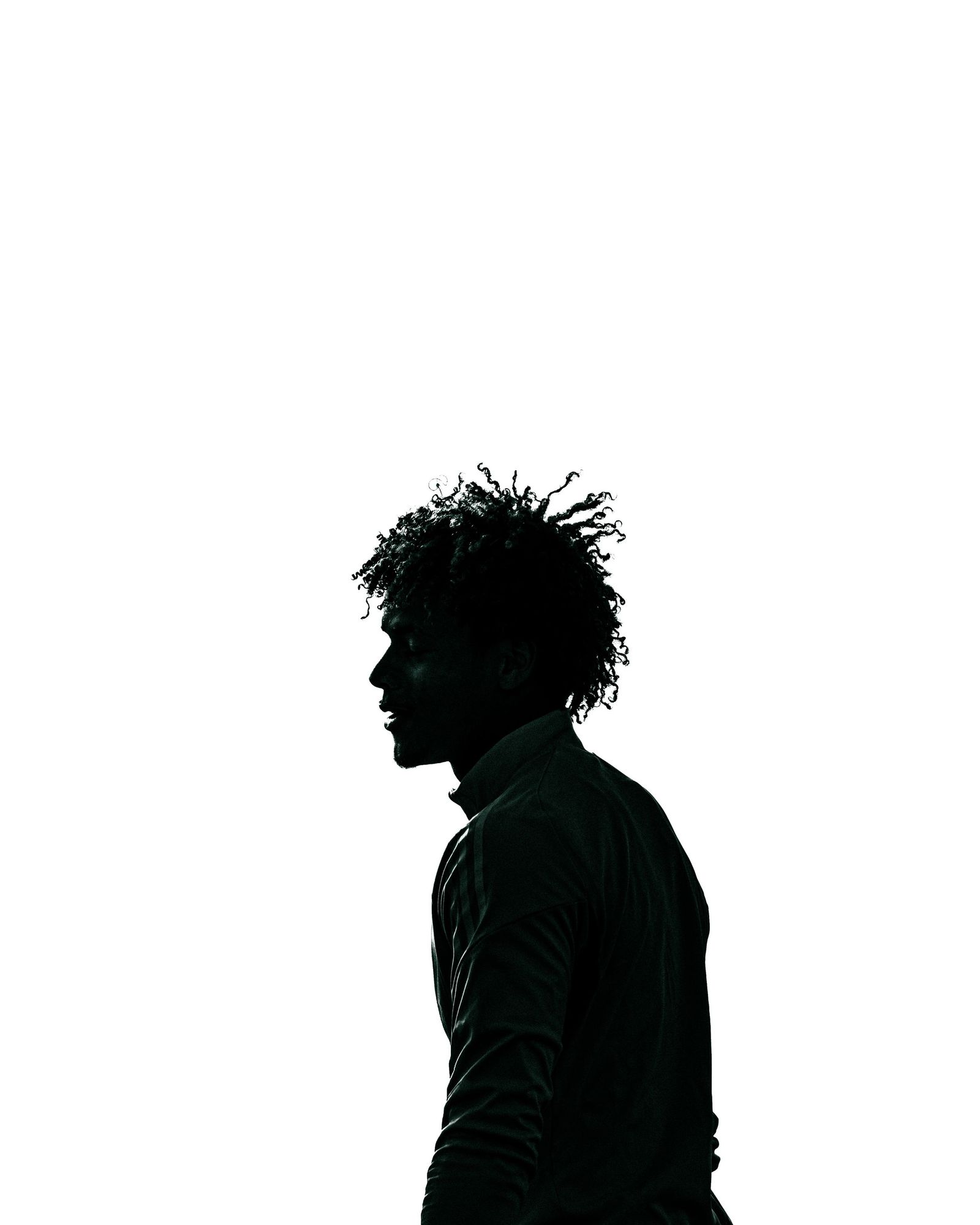 Silhouette of an athlete against white