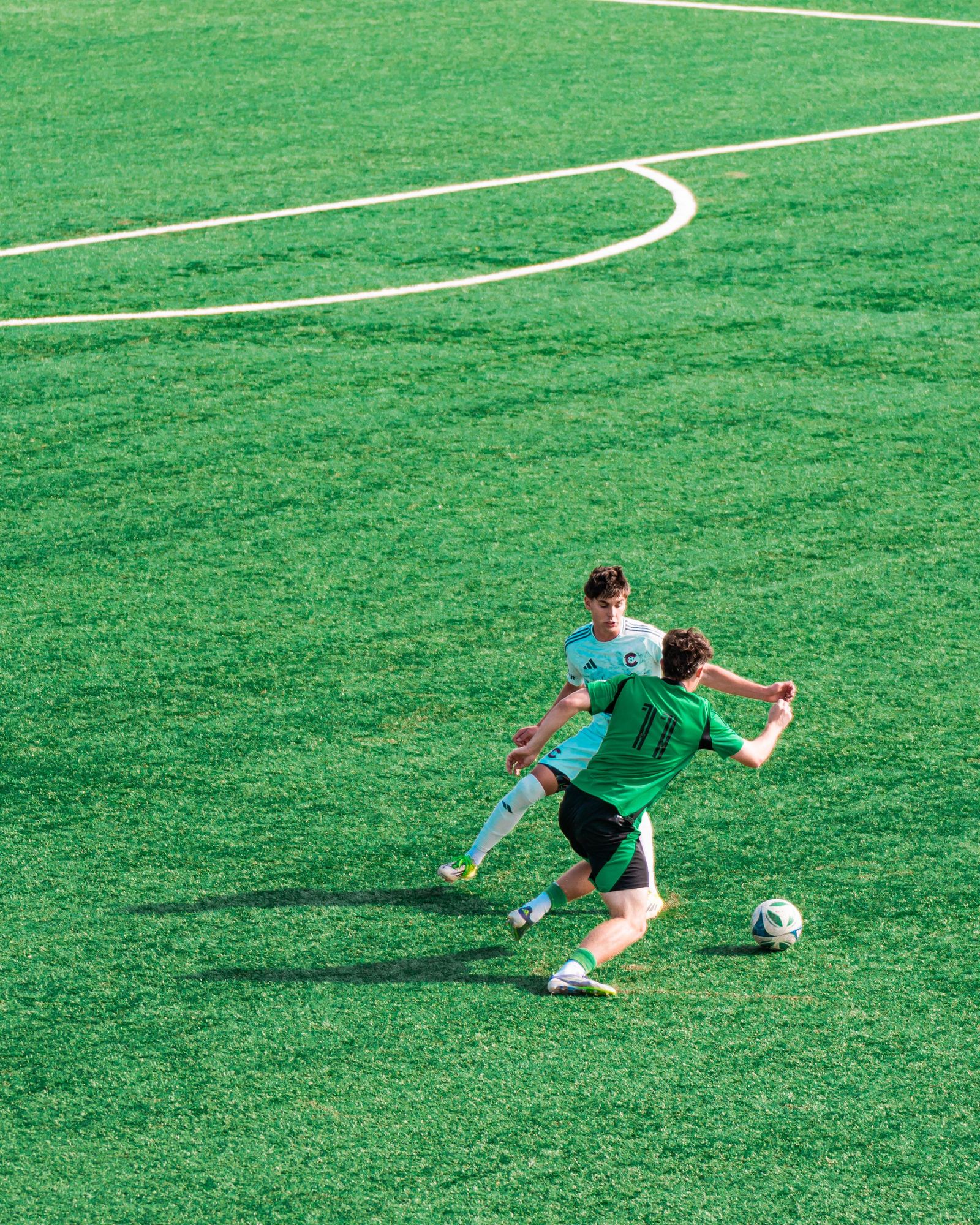 Academy player striking the ball