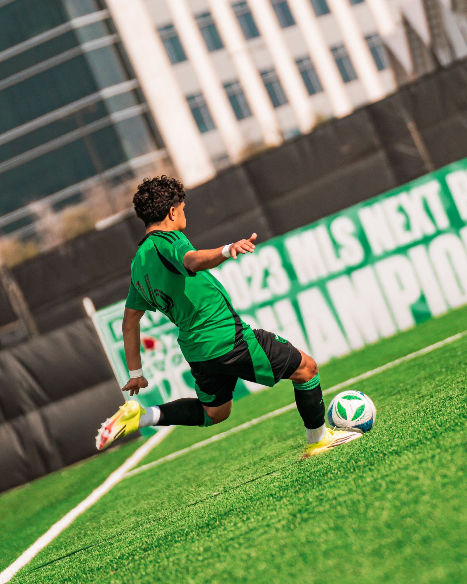 Austin FC academy player crossing the ball