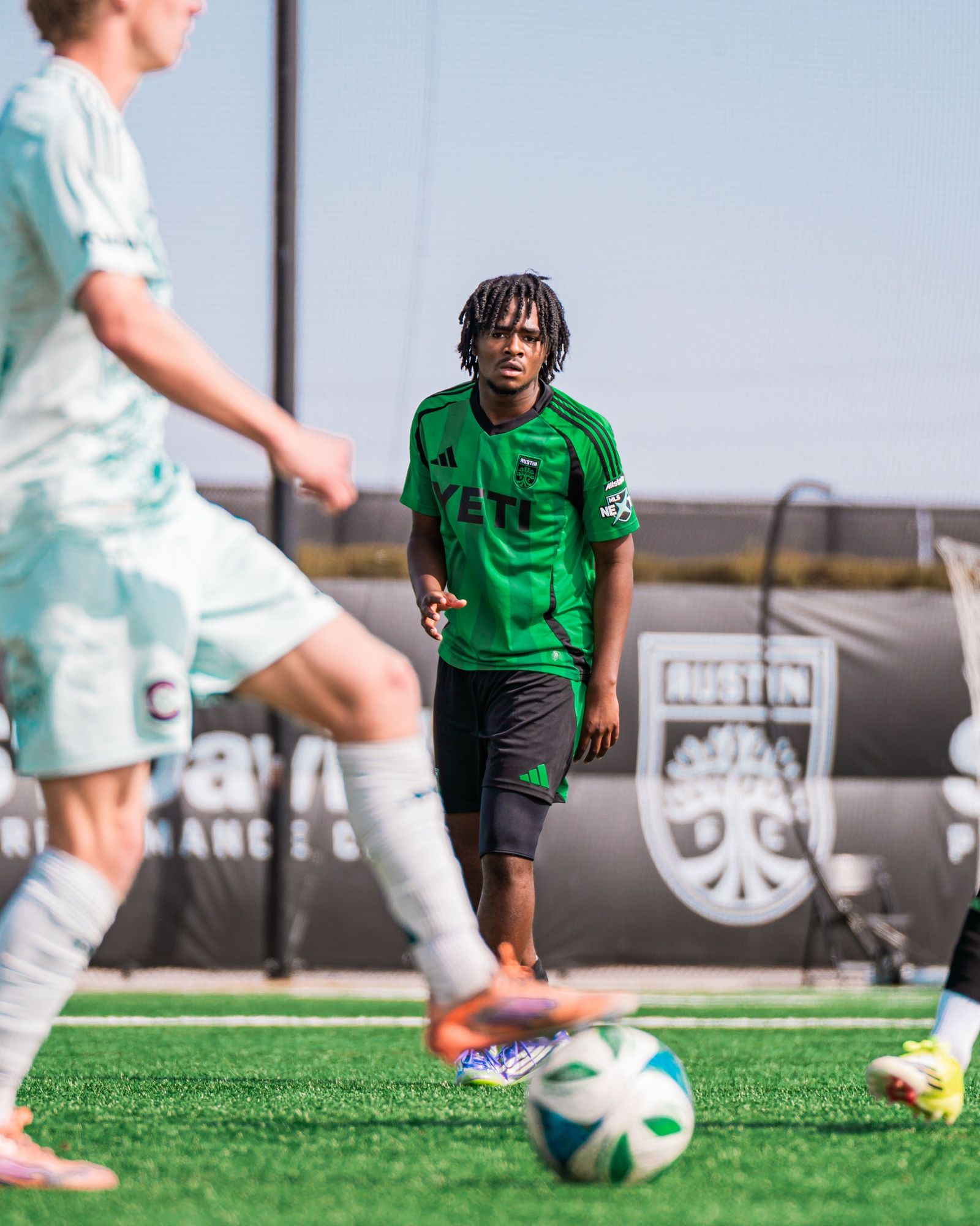 Austin FC academy players competing for the ball
