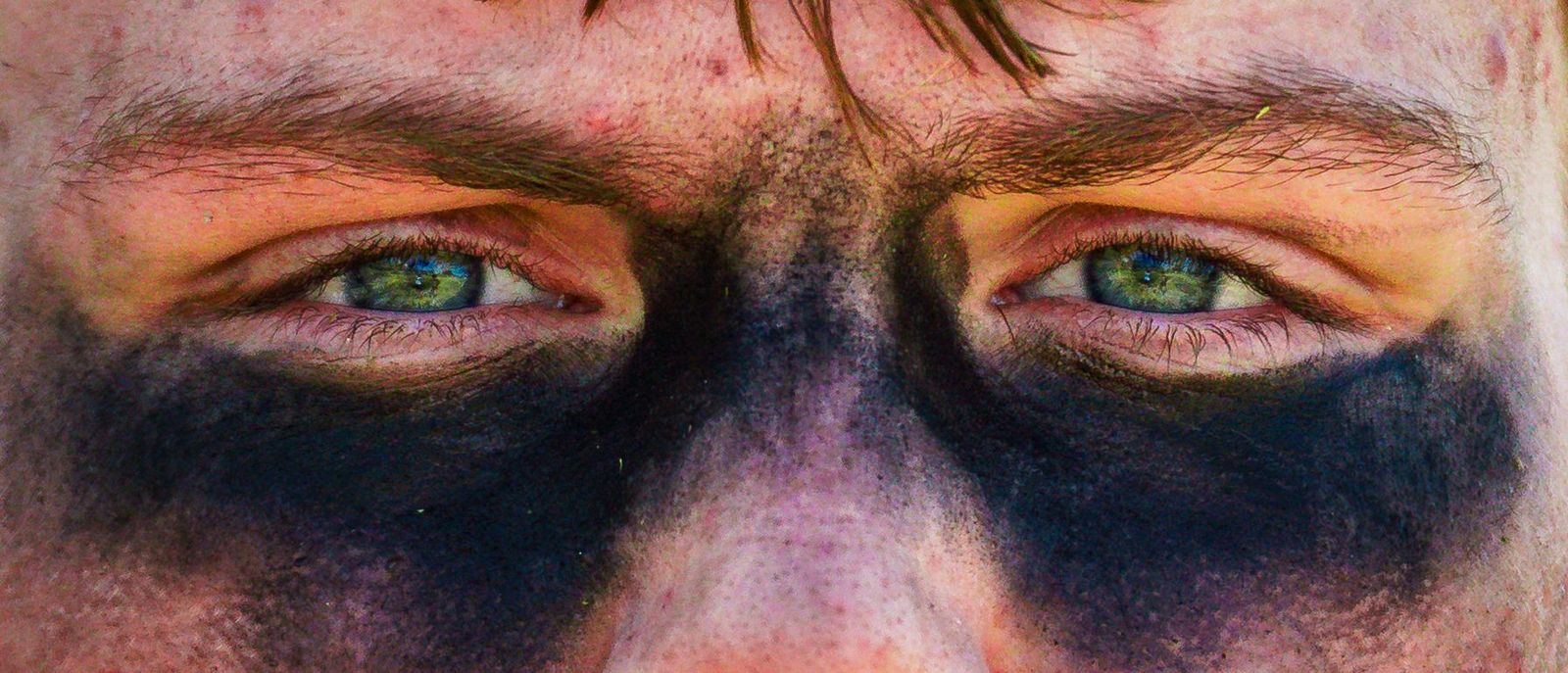 Close crop of eyes with eye black