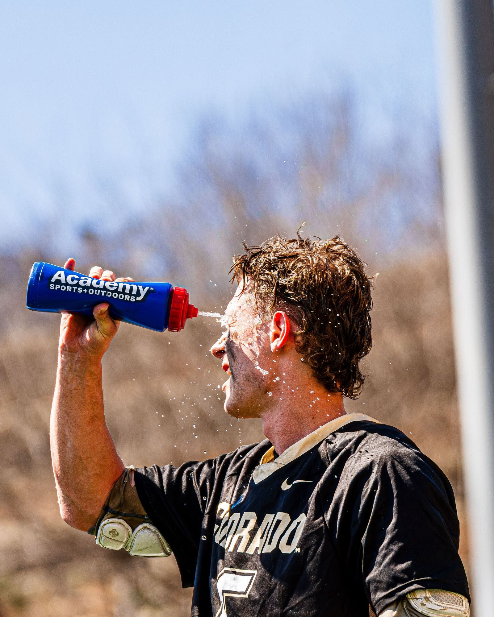 Colorado lacrosse player drinking water