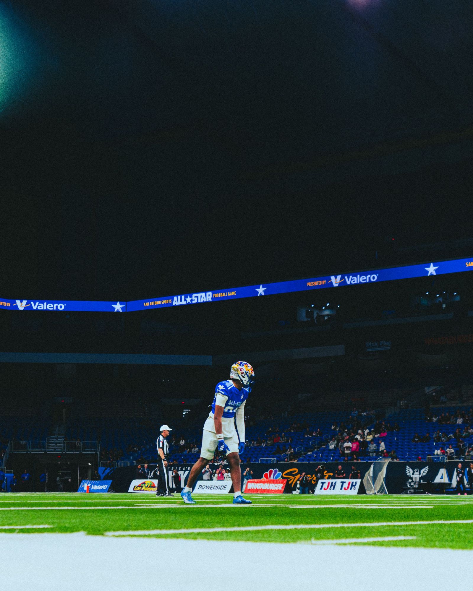 Player standing alone under the arena lights