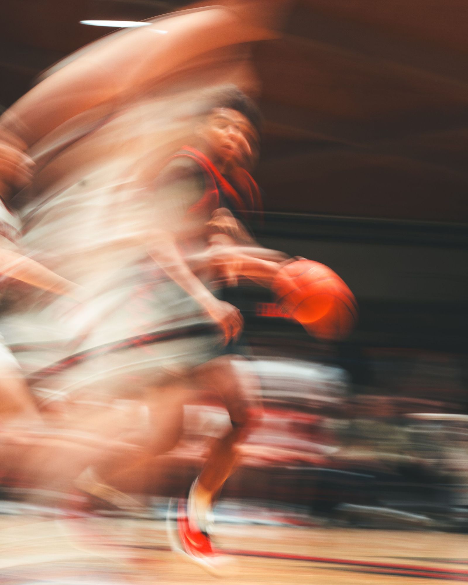 Basketball players in a blur of motion